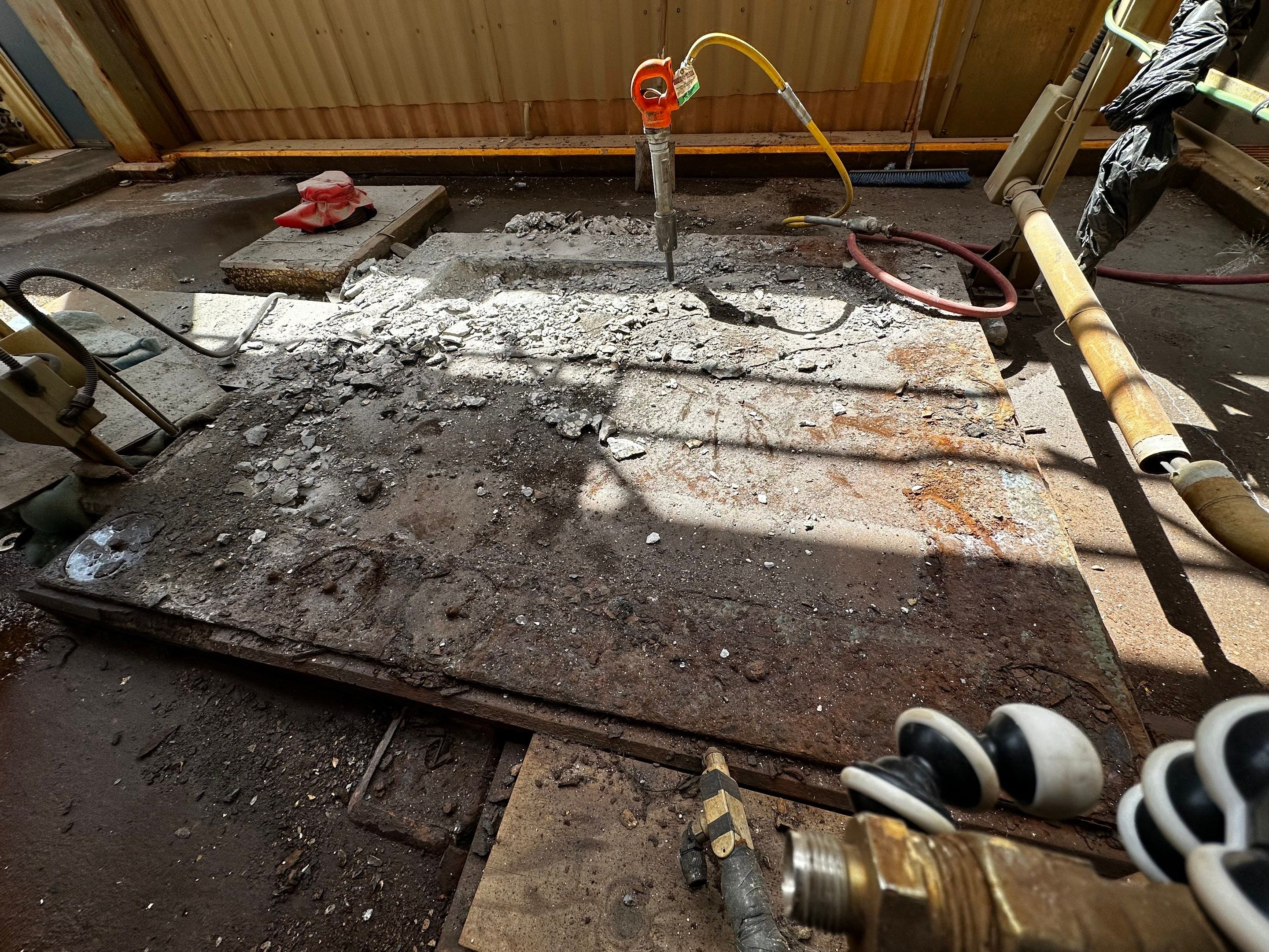 Centrifuge foundation demolition — removal of deteriorated concrete from deck underside