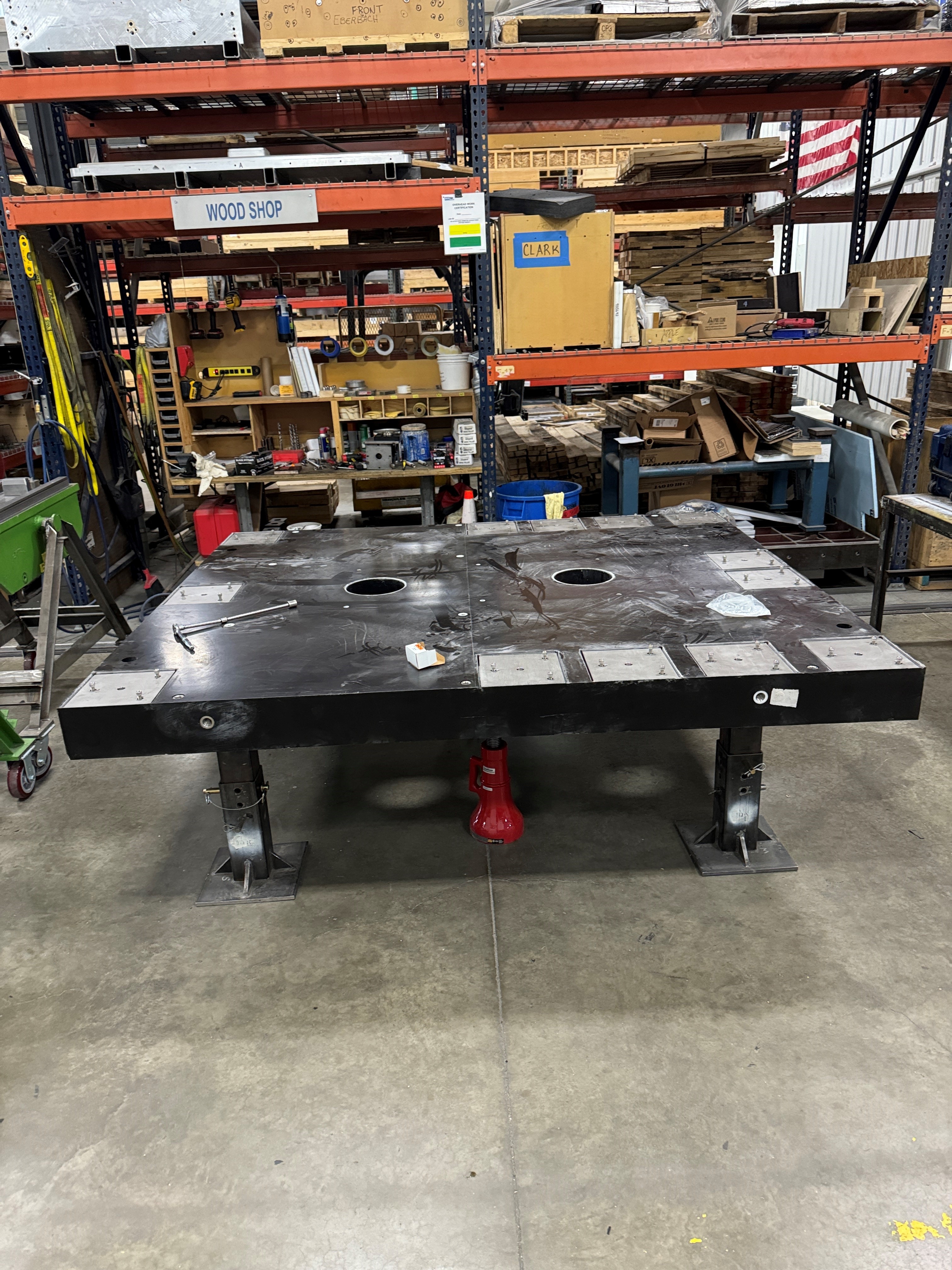 Underside view of centrifuge equipment — deck and isolator inspection after polymer block installation