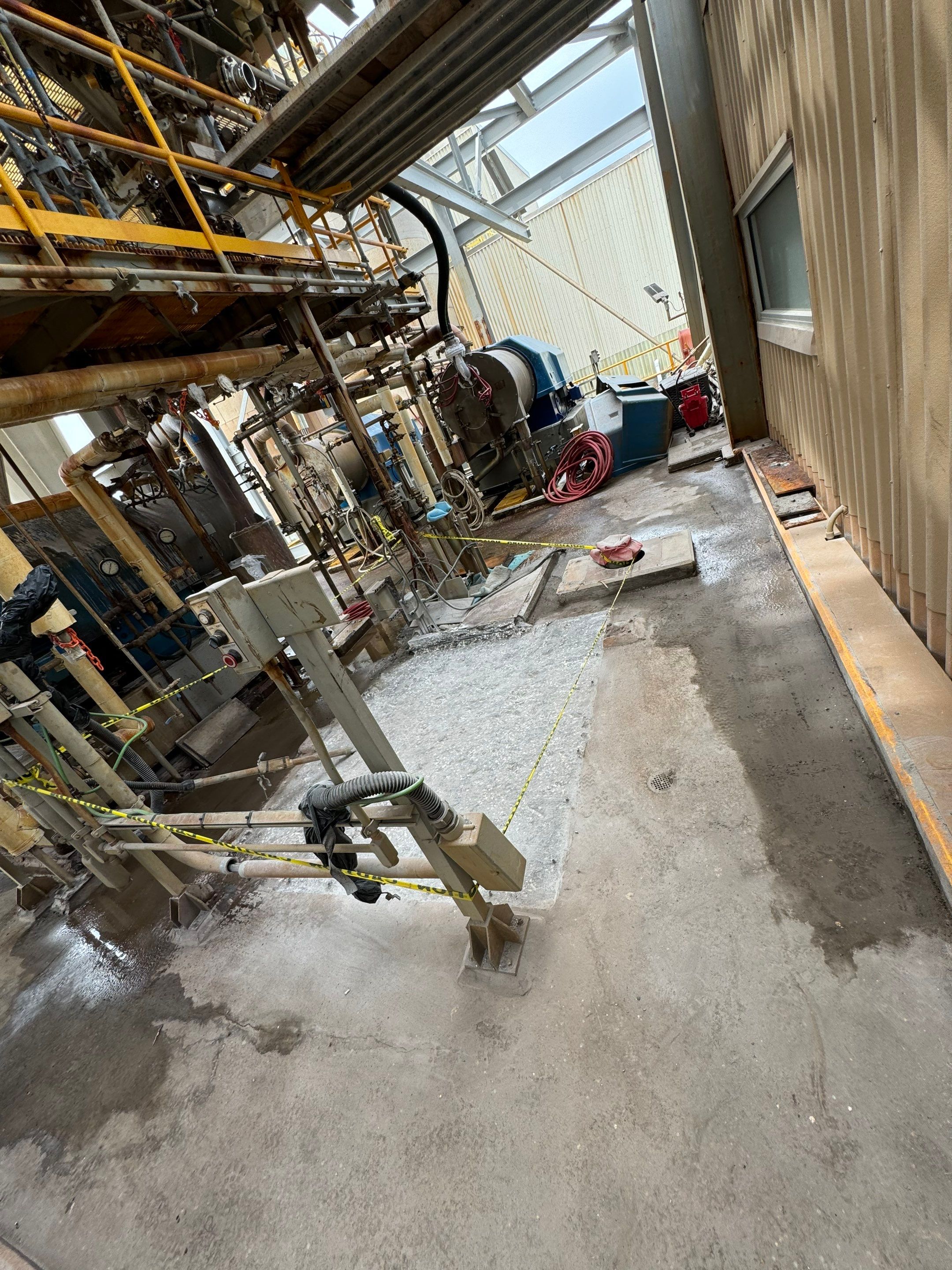 Post-demolition centrifuge deck — clean substrate ready for polymer block foundation installation